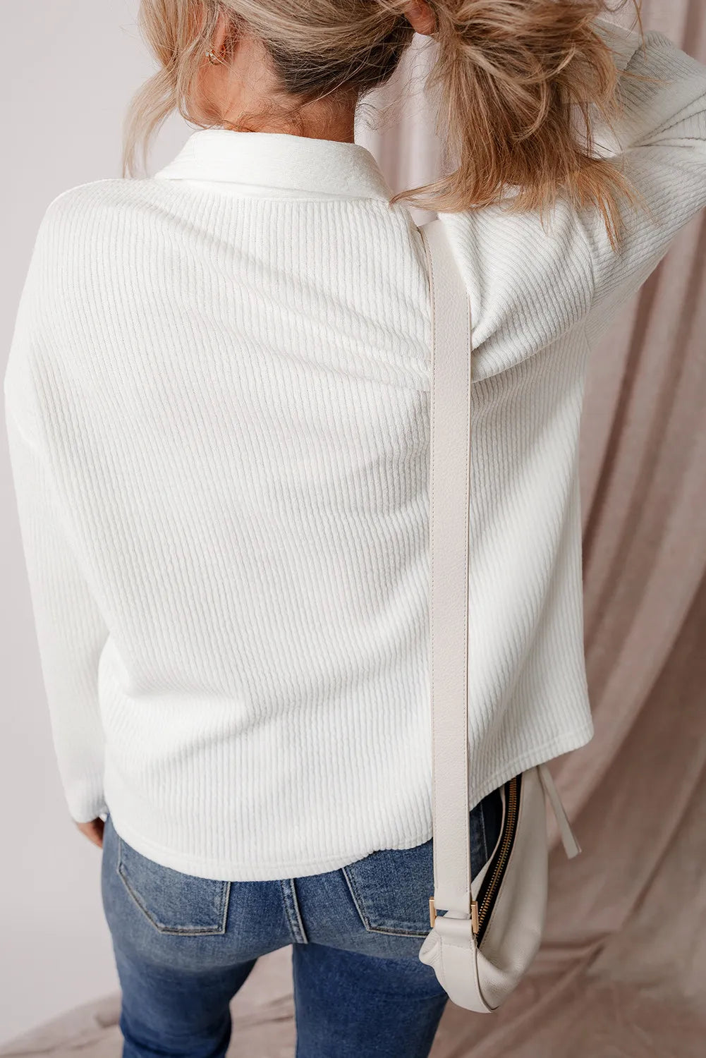 White long-sleeve shacket back view with yoke seam and folded stand collar.