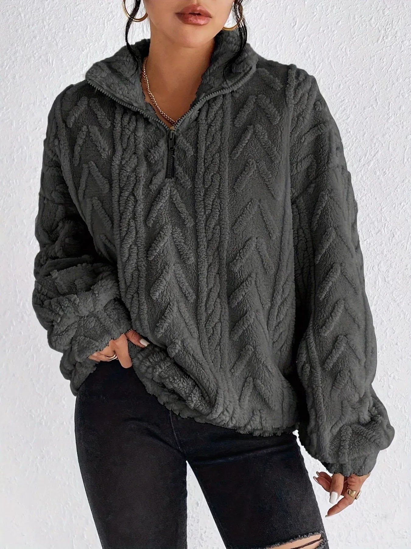 Dark gray sherpa quarter-zip sweatshirt with textured cable knit and dropped shoulders