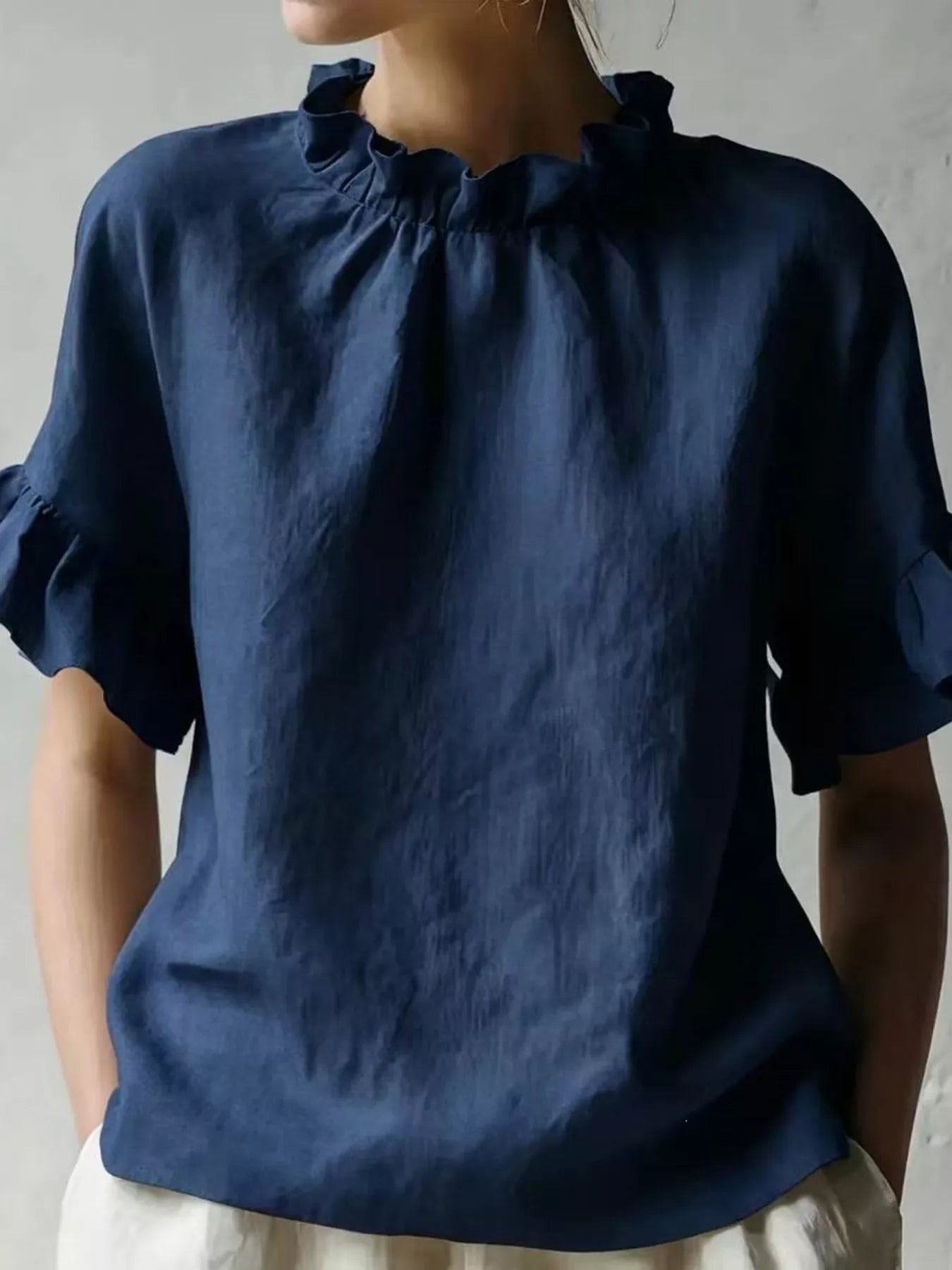 Navy ruffled-neck half-sleeve blouse with gathered collar and short ruffled sleeves