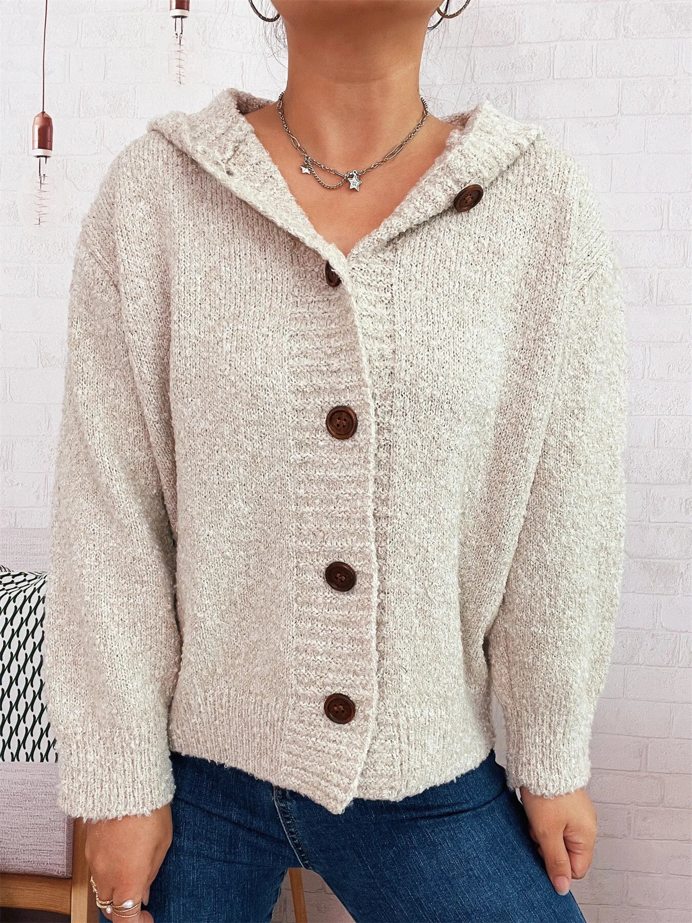 Cozy hooded cardigan, cream knit with button front and hood.