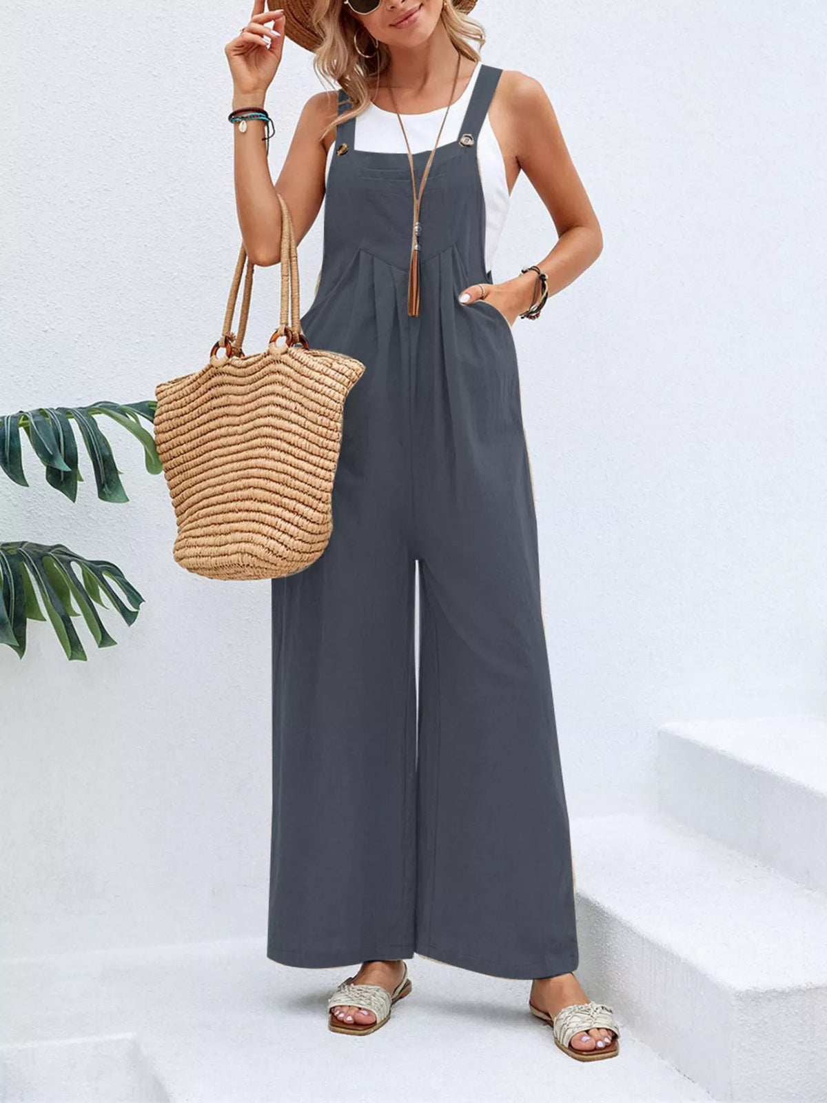 Dark gray wide-leg overalls with front pockets and roomy straight-wide legs