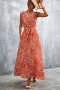 Orange-red printed maxi dress with V-neck and tie waist, sleeveless, ankle length