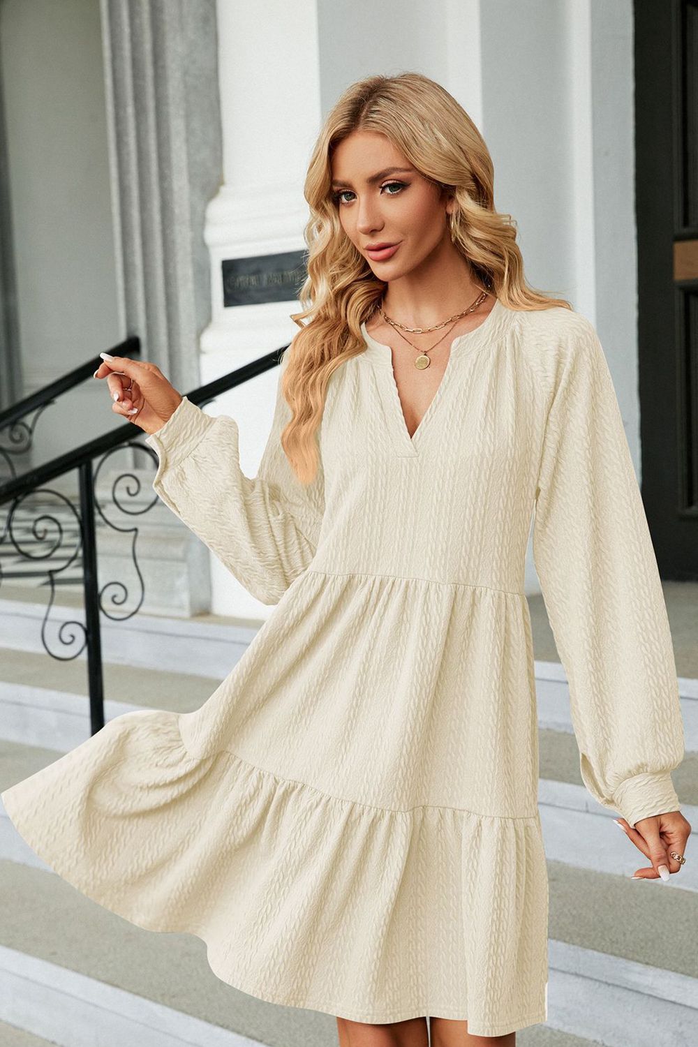 Cream notched-neck long-sleeve mini dress, tiered skirt and V-neck front view