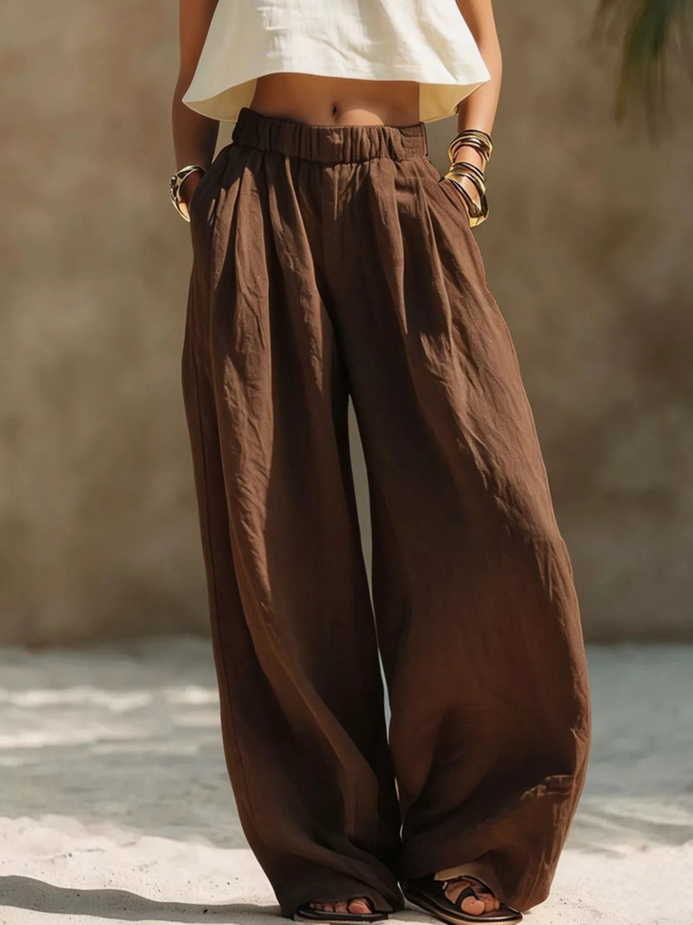 Dark brown wide-leg pants with elastic waistband and side pockets