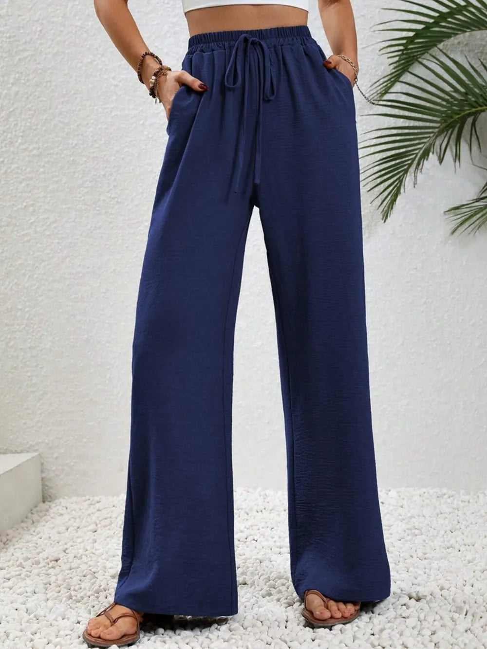 Navy wide-leg drawstring pants with elastic waistband and flowy wide legs