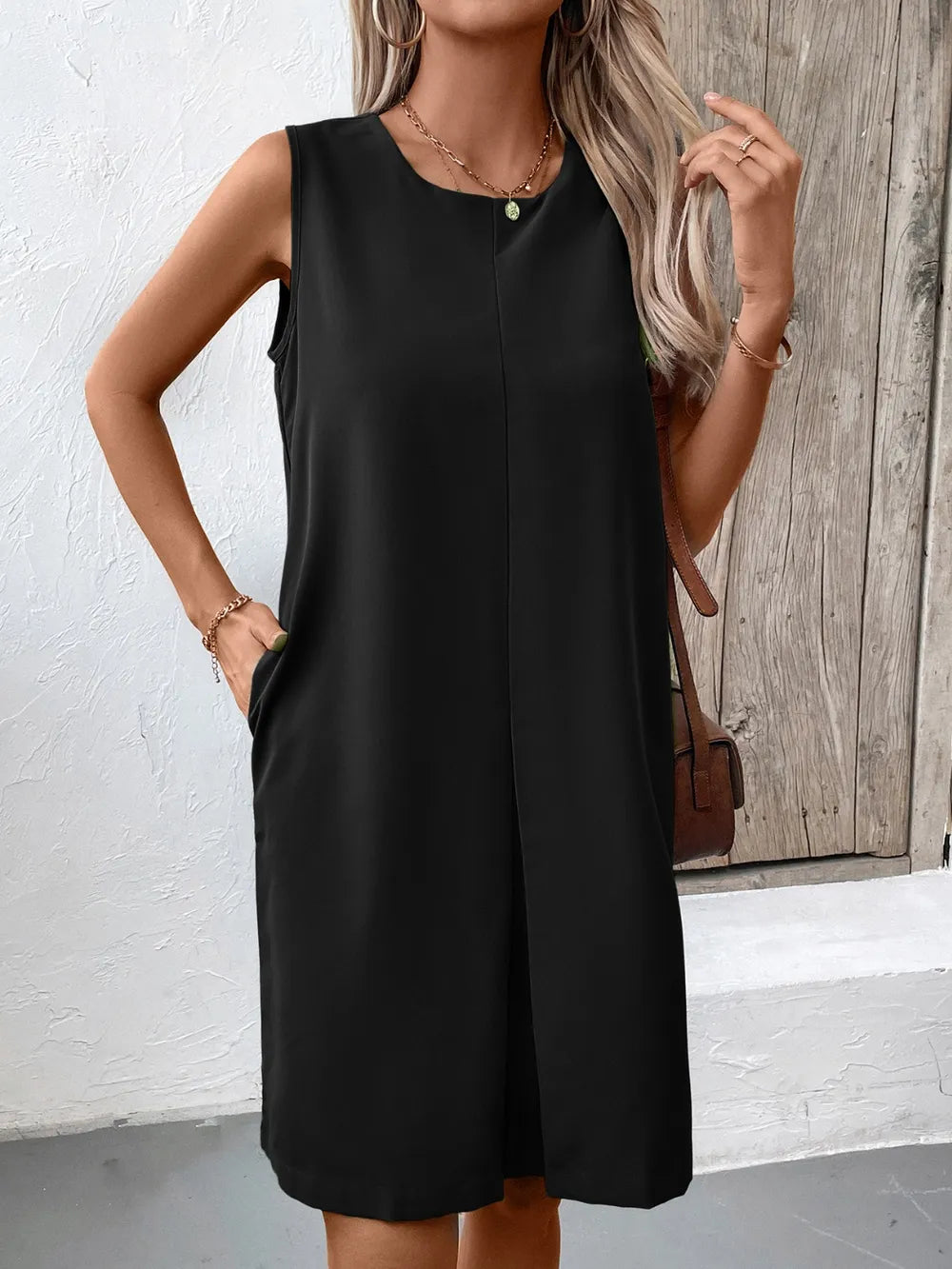 Ivy Lane pocketed round-neck sleeveless mini dress in black by Trendsi