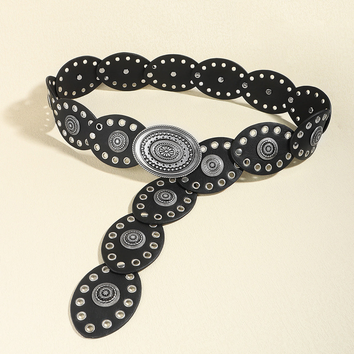 Black vegan leather belt with silver oval buckle and repeating oval stud medallions