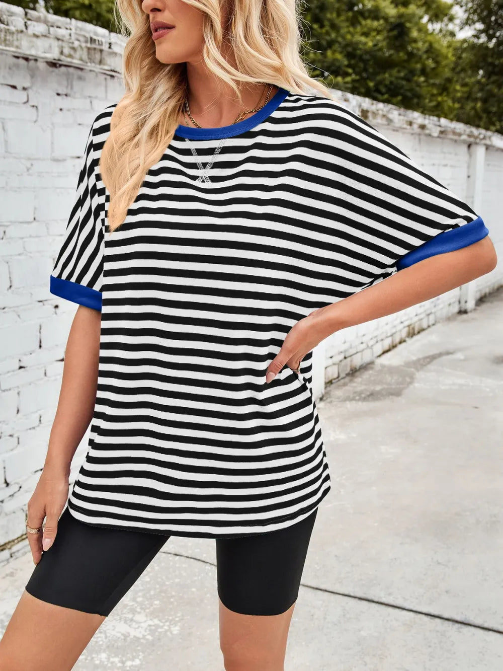 Striped round-neck half-sleeve T-shirt in black with white stripes and blue neckline