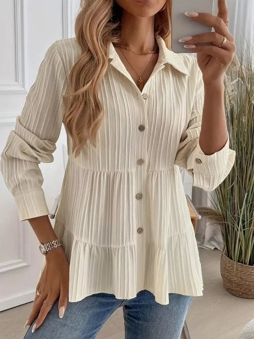 Cream tiered button-down long-sleeve shirt with striped texture and gold buttons