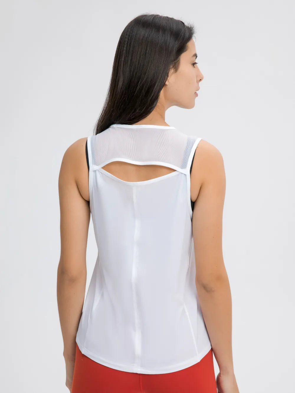 White active tank top with cutout back and crisscross strap detail