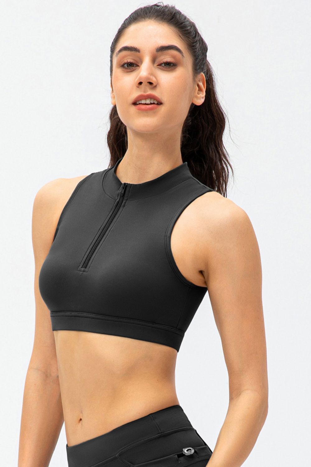 Black cropped active tank top with front half-zip and sleeveless high neck