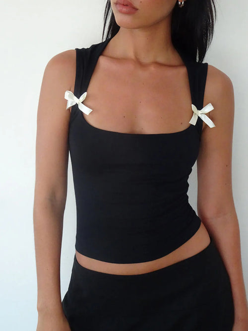Black cropped tank with square neckline and white bow straps on the shoulders