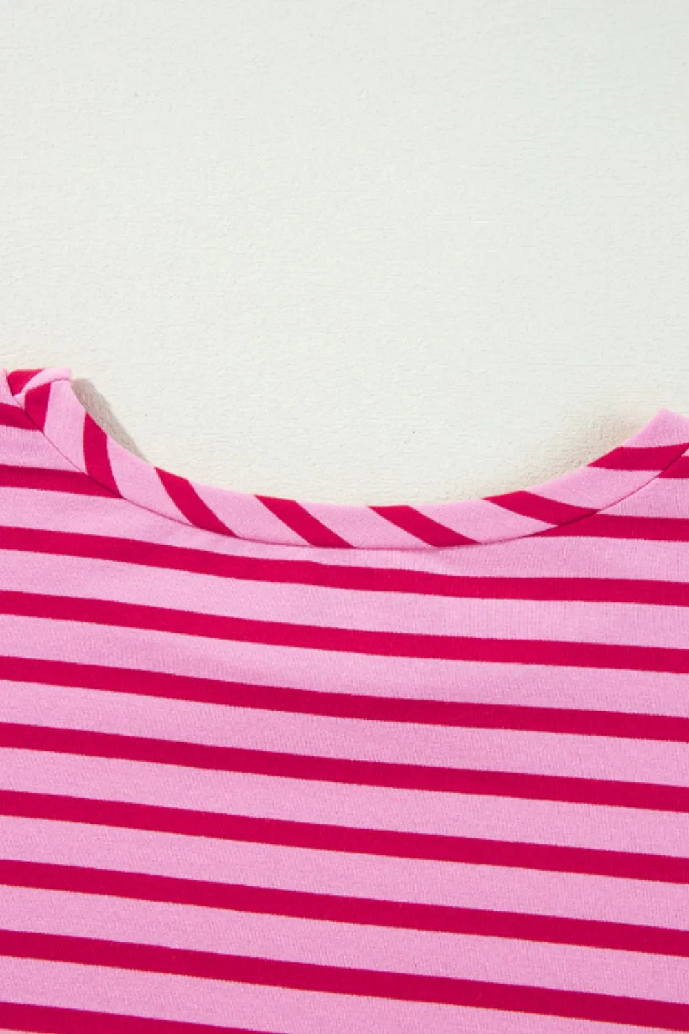 Hot pink and white striped sweatshirt neckline with gathered collar band.