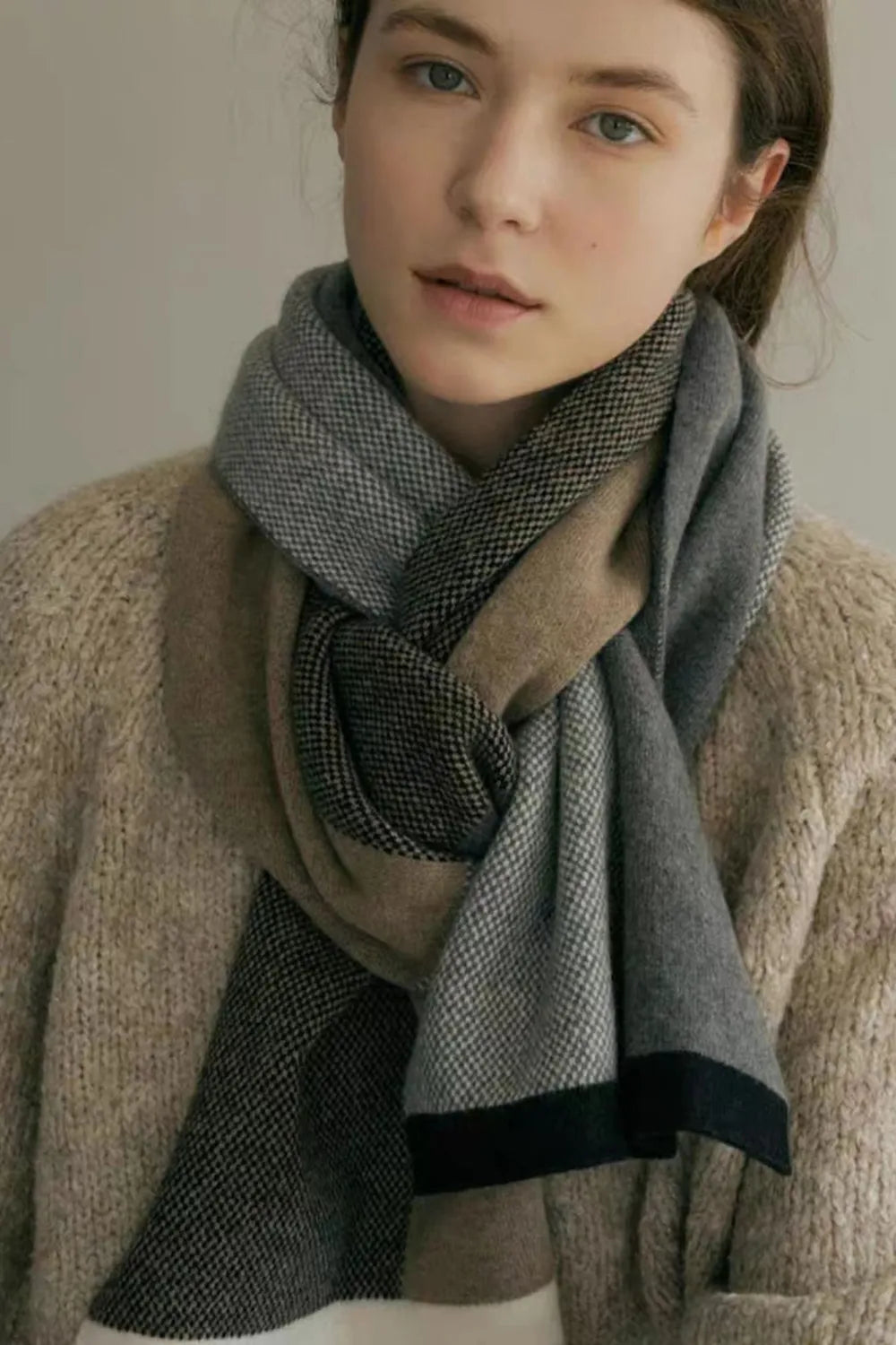 Contrast acrylic scarf in dark gray with light taupe blocks and a dark stripe, woven texture