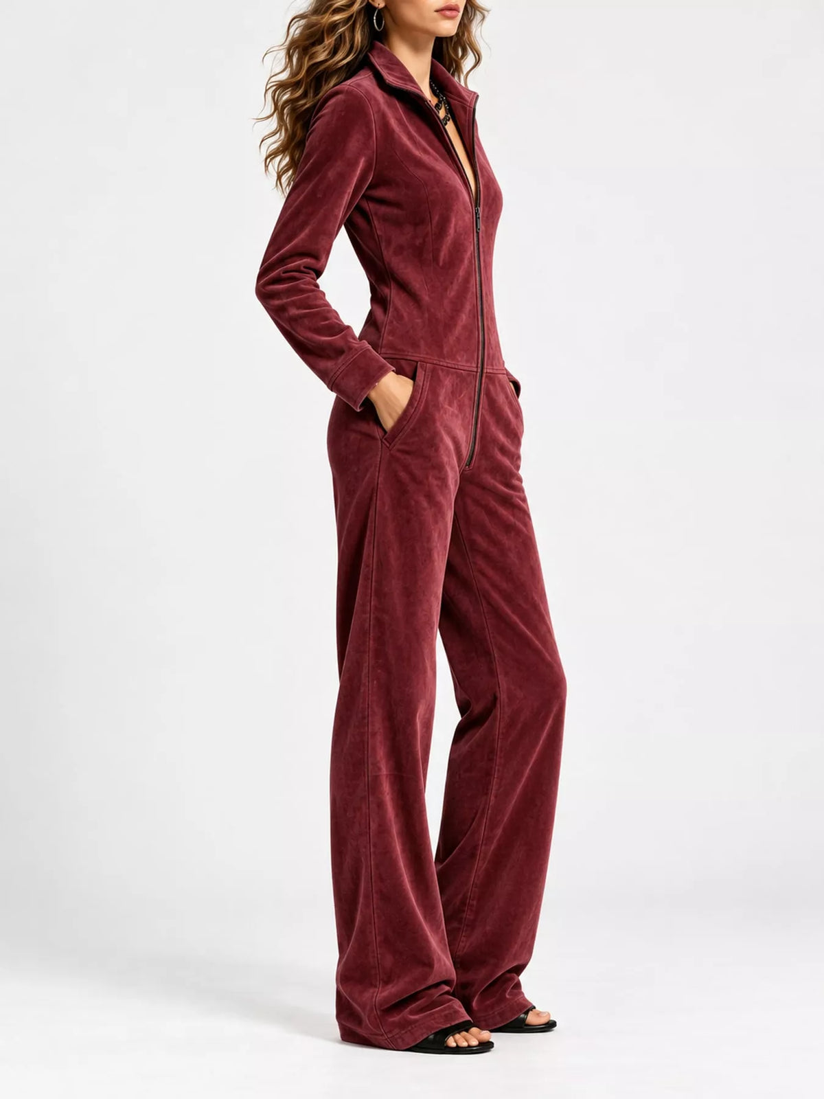 Wine red velour zip-up jumpsuit with long sleeves and front pockets