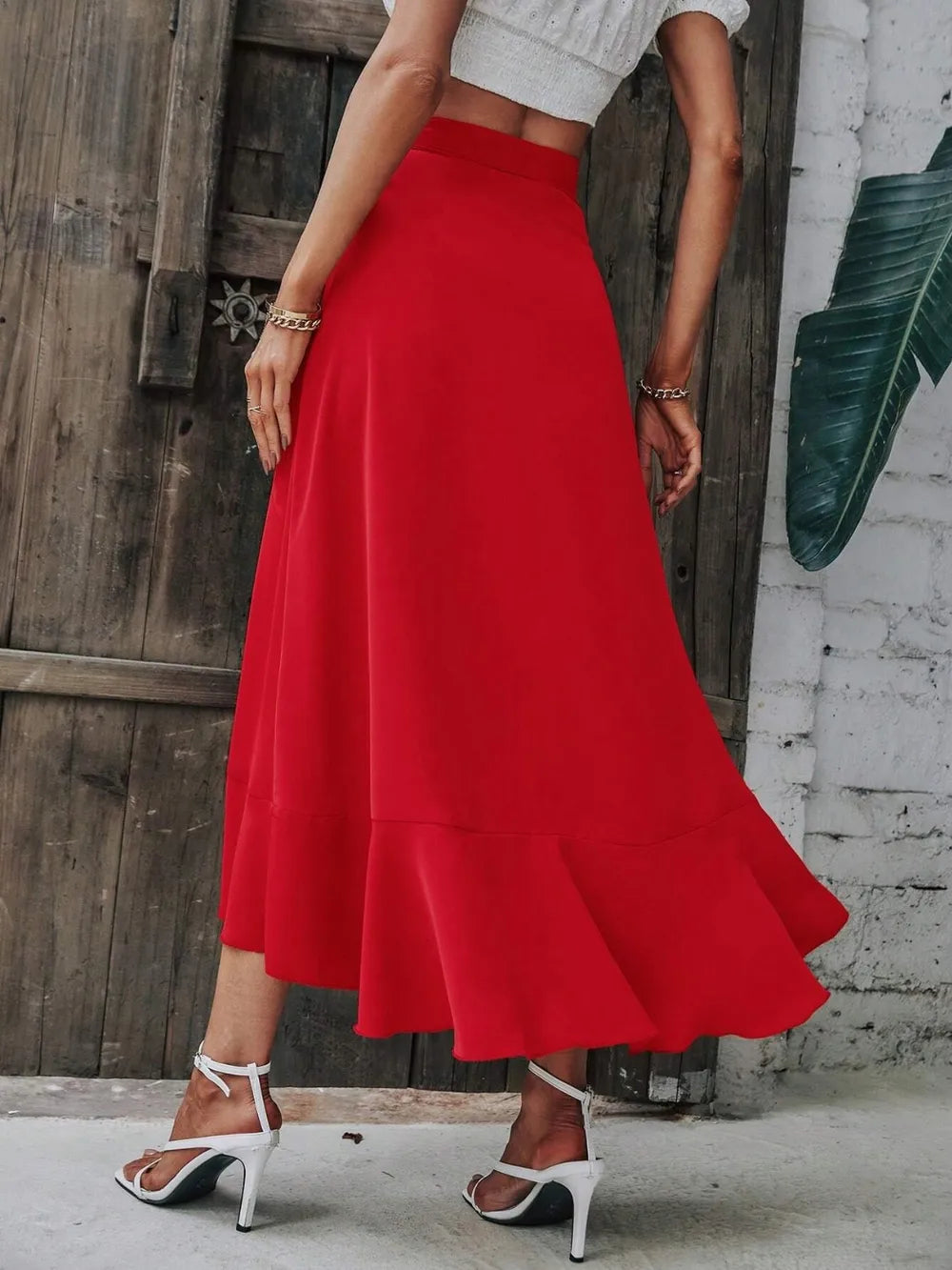 Tied ruffled midi skirt in bright red with gathered waist and cascading ruffle tiers
