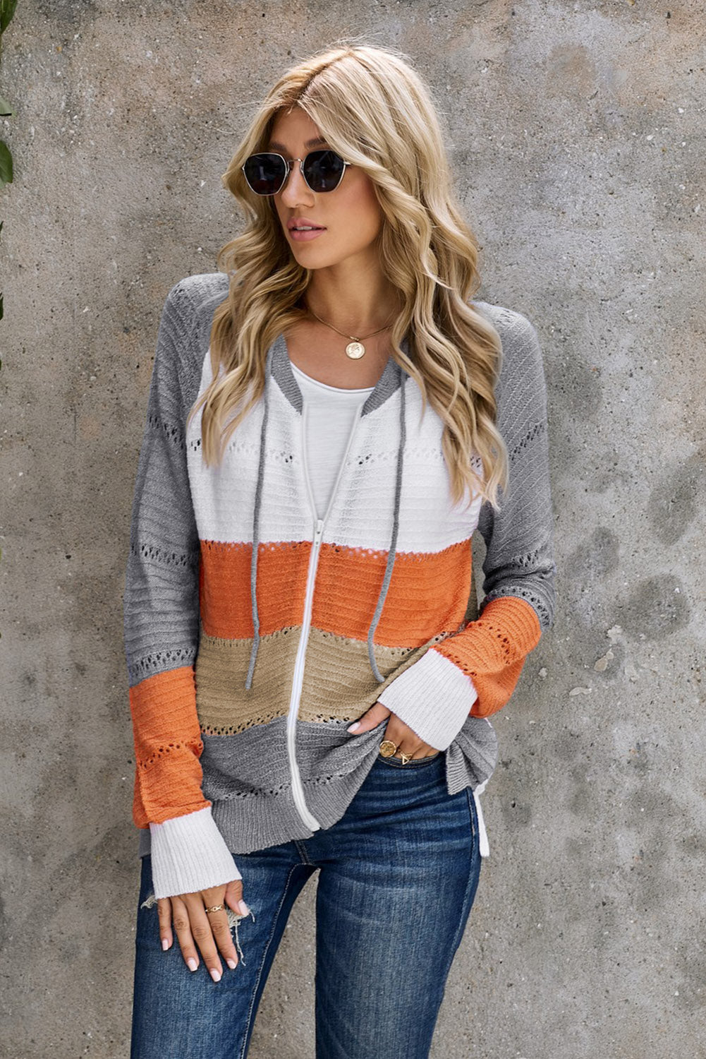 Gray zip-up hooded cardigan with openwork sleeves, white front and orange stripe blocks