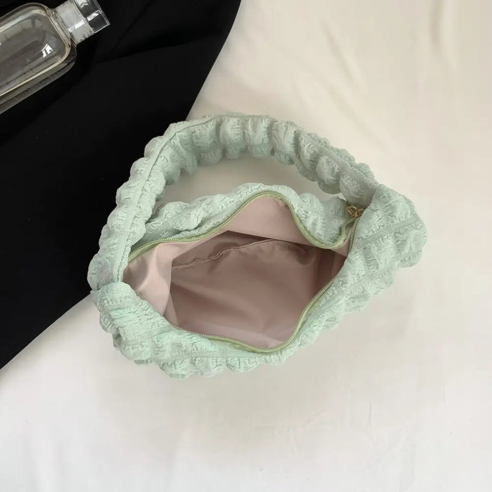 Light green textured small hobo handbag with open interior