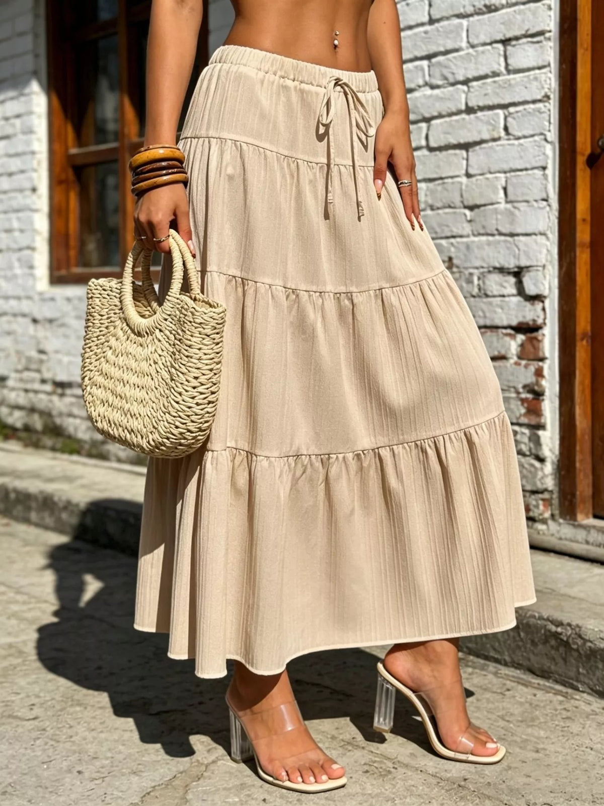 Cream tiered maxi skirt with ruched drawstring waist and tiered ruffles