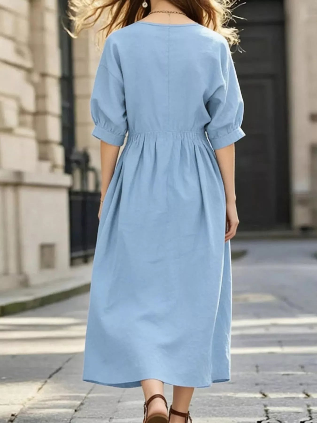 Light blue back view notched V-neck midi dress with half sleeves and gathered waist