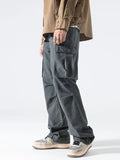 Dark gray washed cargo jeans with flap pockets and relaxed straight-leg fit.