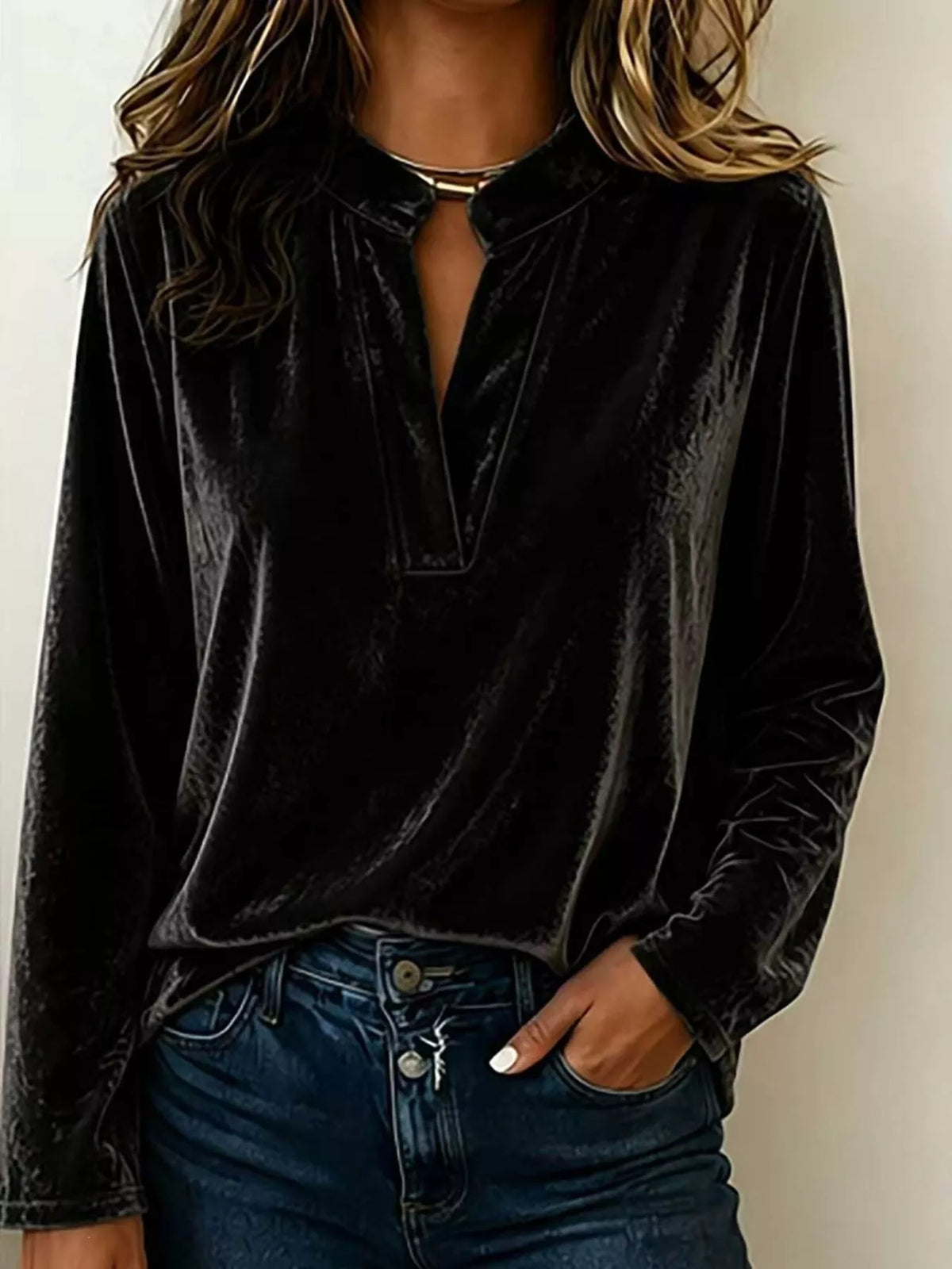 Black velvet long-sleeve blouse with notched collar and V-slit neckline