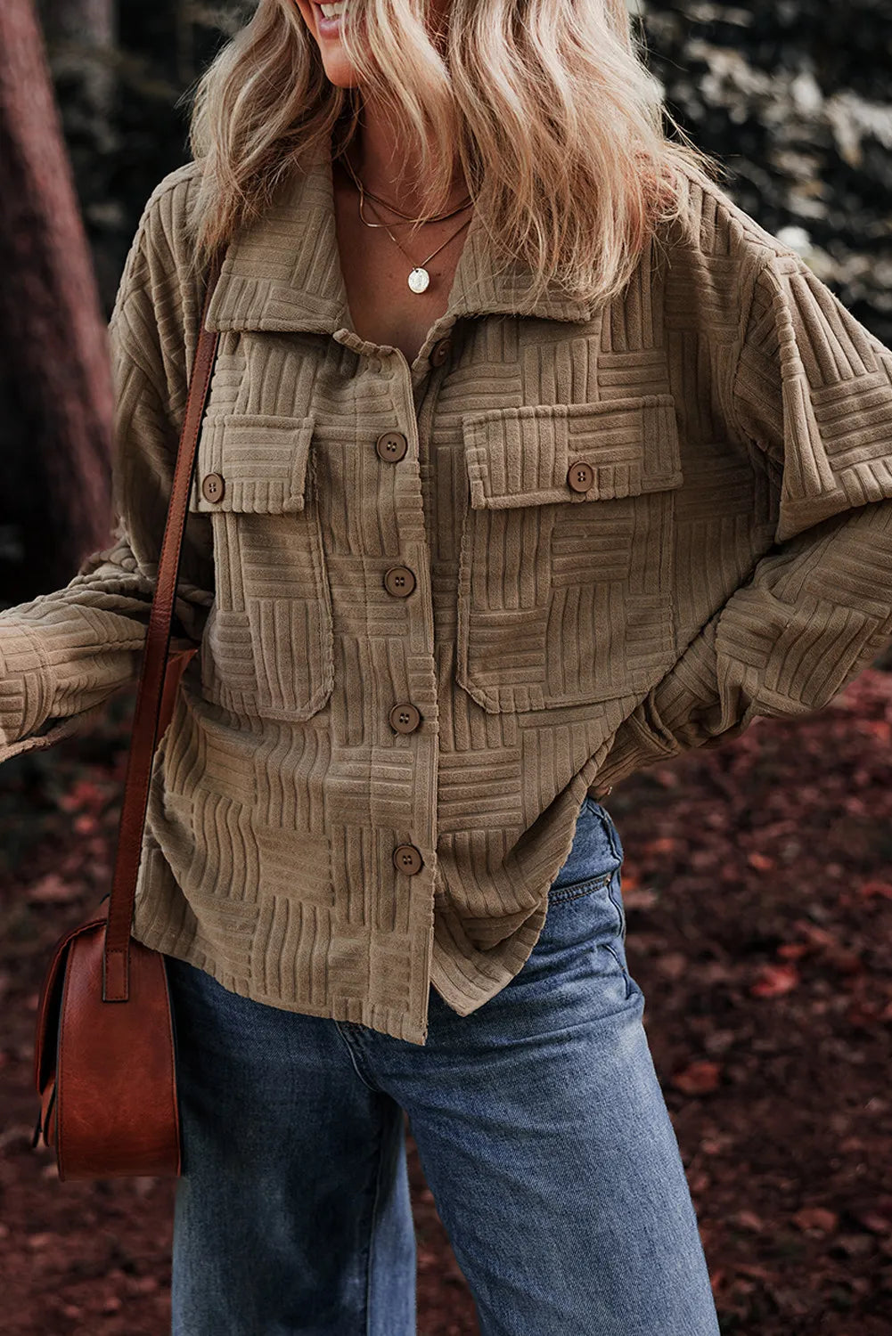 Taupe textured collared shacket with button front and flap chest pockets, side view