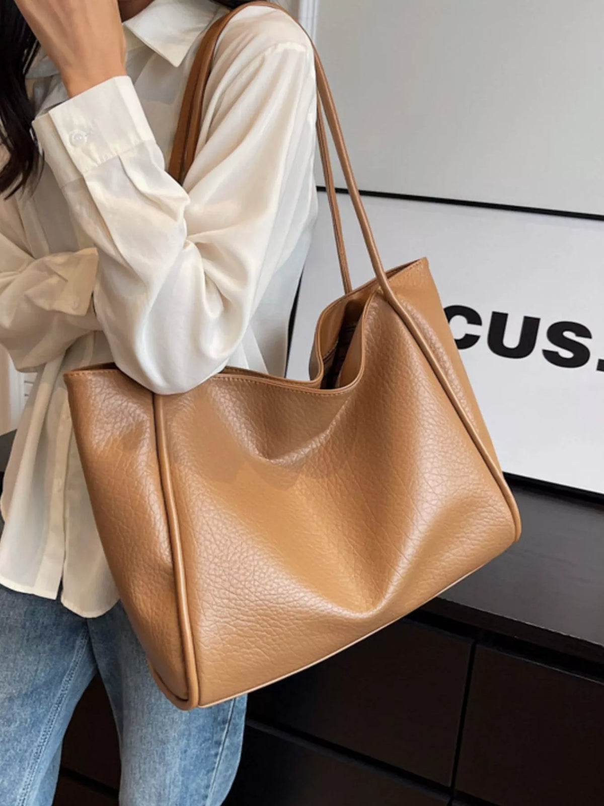Khaki vegan leather tote bag with smooth finish and wide open top
