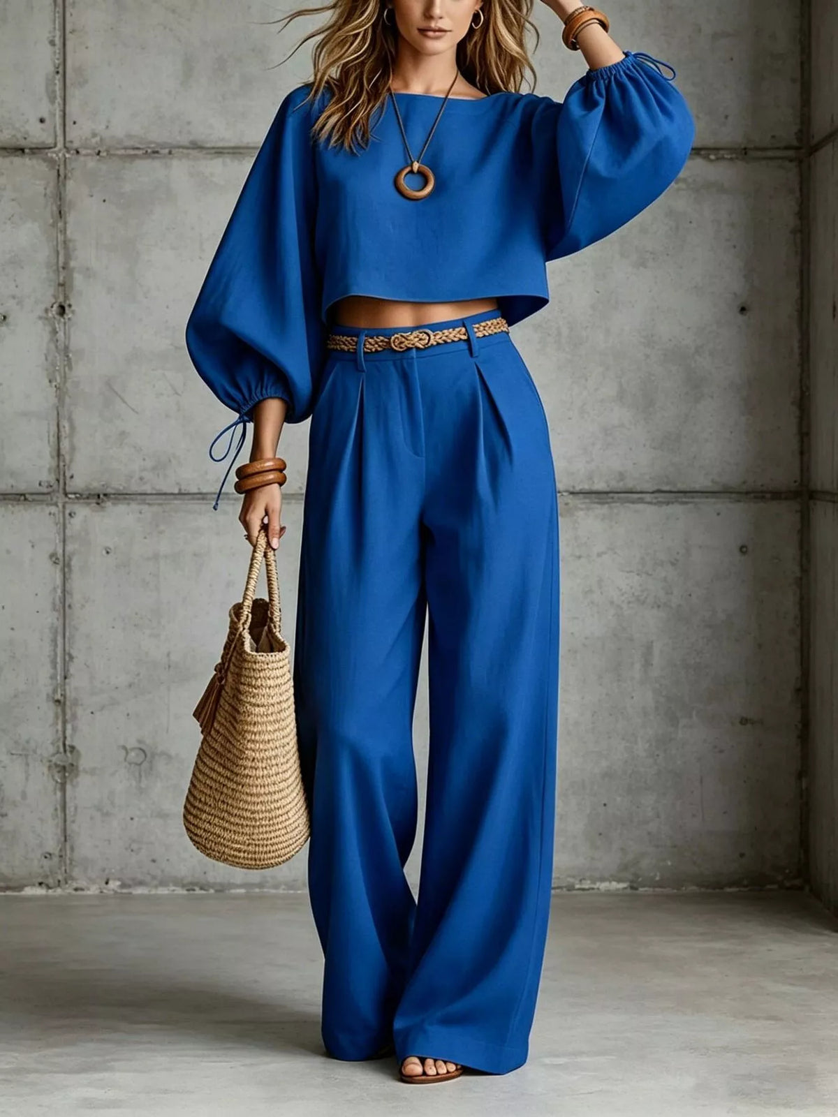 Navy blue two-piece set with balloon-sleeve cropped top and wide-leg pants