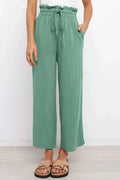 Green wide-leg drawstring pants with paperbag-style waist and straight, flowy legs