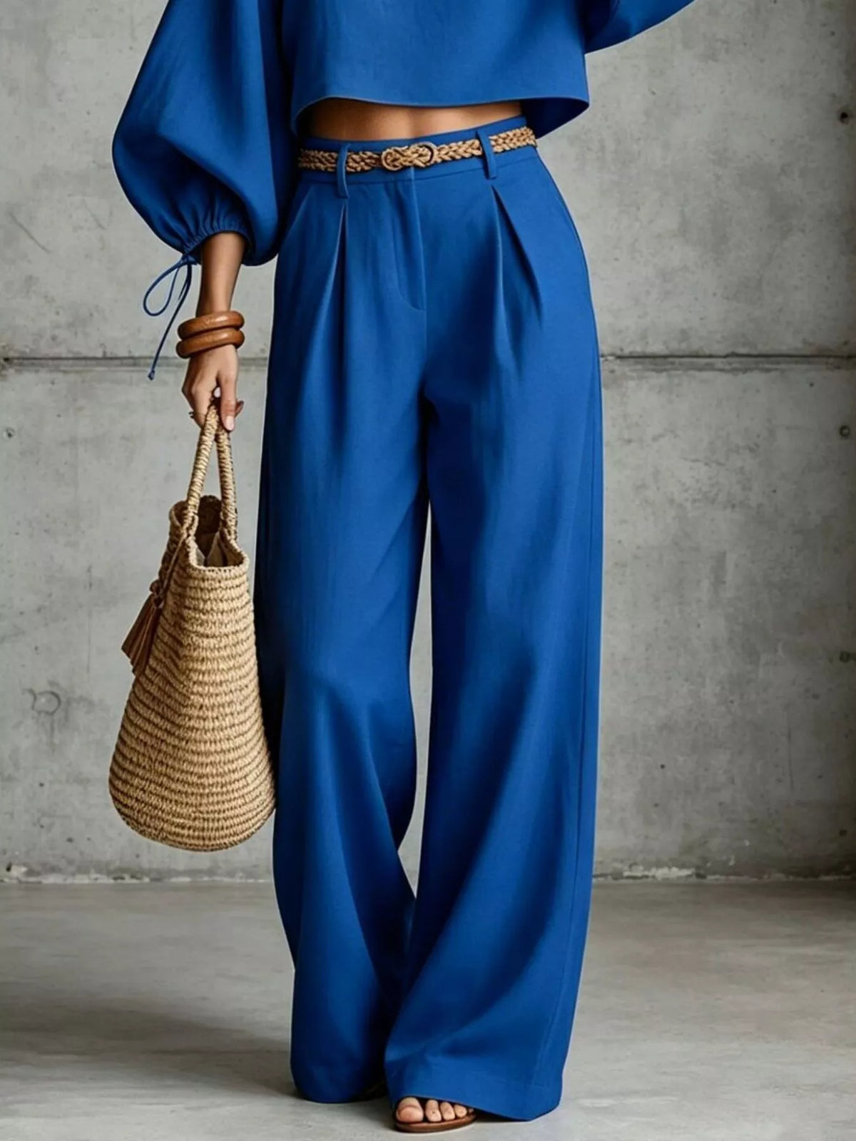 Navy blue wide-leg pants with embroidered waist belt and balloon-sleeve crop top