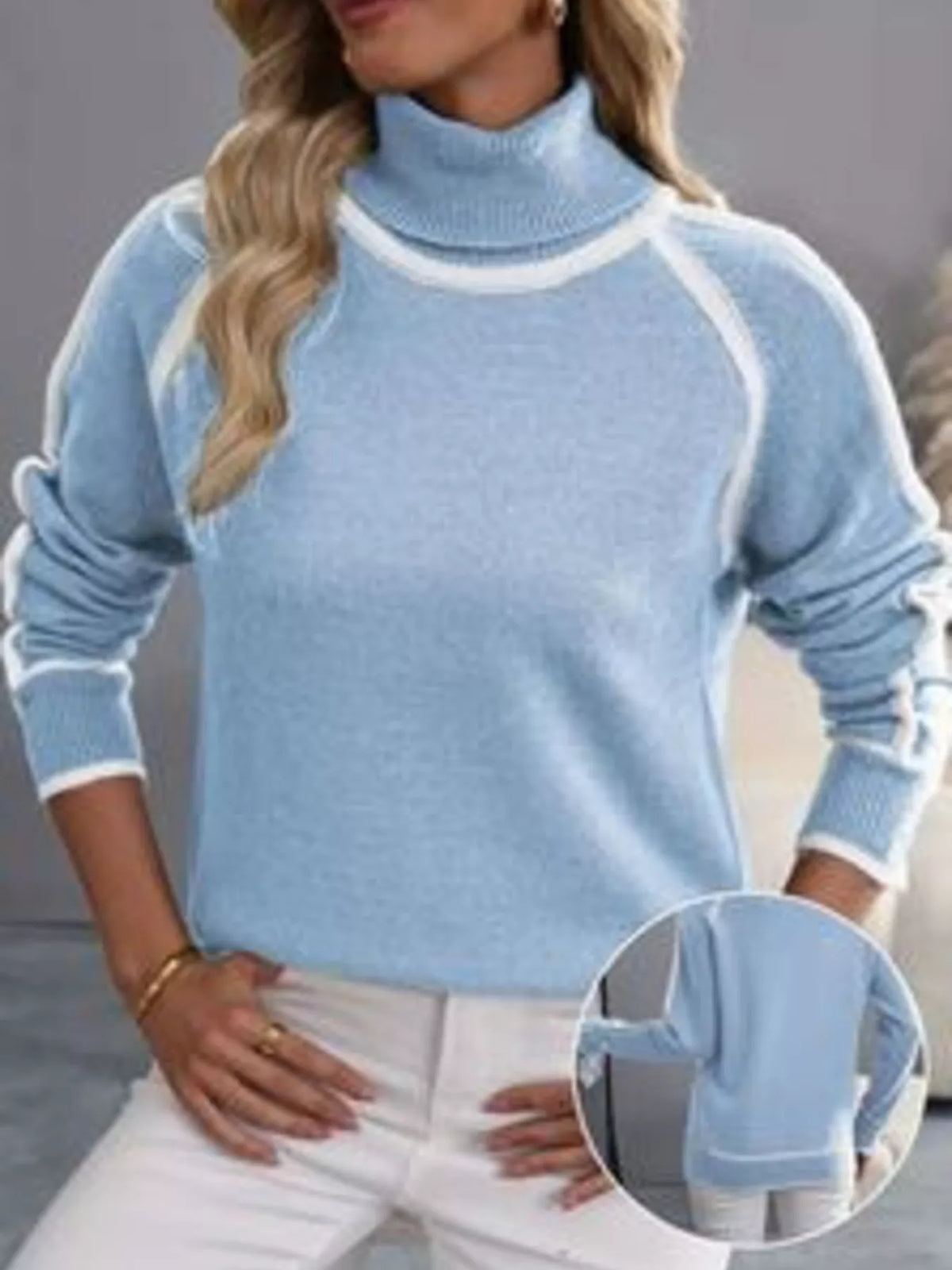 Light blue ribbed turtleneck sweater with white contrast stripe trim along sleeves