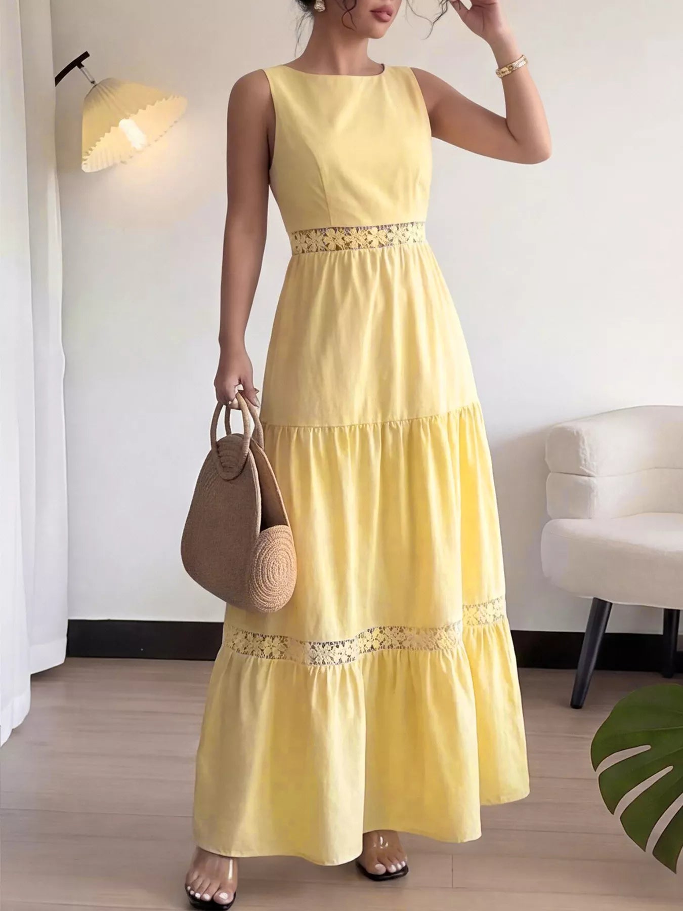Yellow sleeveless tiered maxi dress with lace trim on tiered skirt