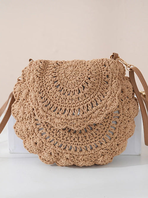 Khaki crochet crossbody bag with flap, braided strap and gold-tone hardware.