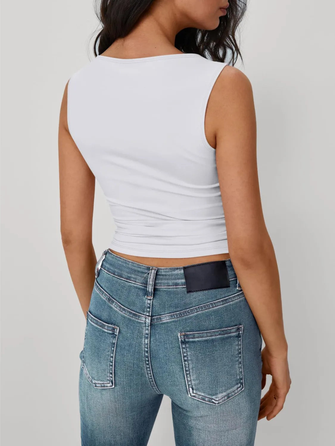 Solid round neck tank, white, sleeveless back view with gathered waist