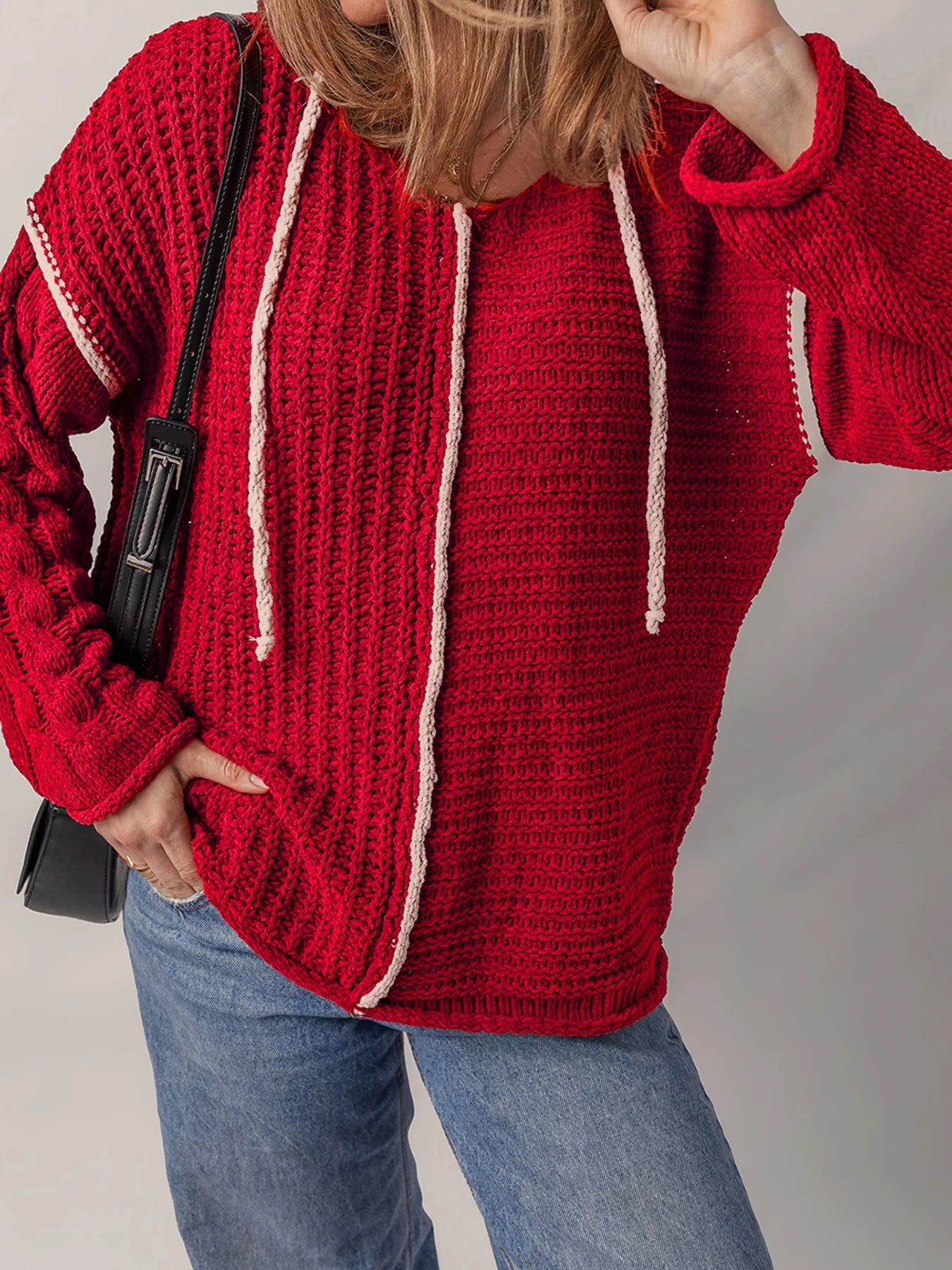 Deep red hooded knit sweater with white contrast stripes and drawstring cords
