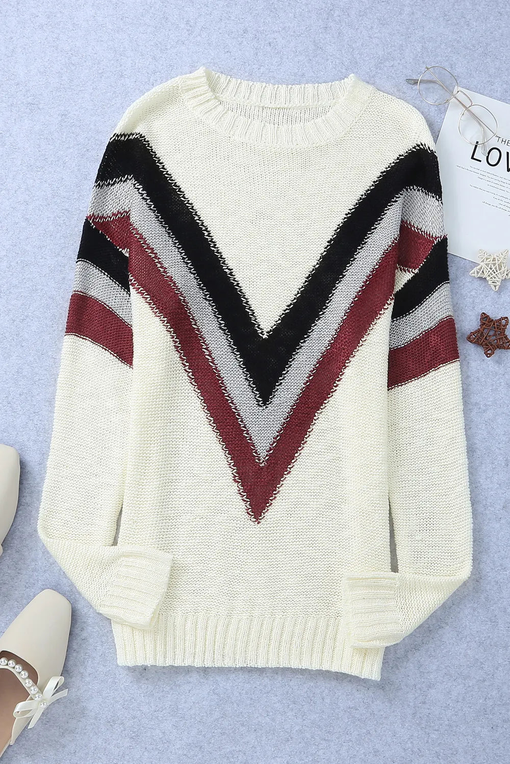 Cream chevron long sleeve sweater with black and burgundy zigzag V neckline