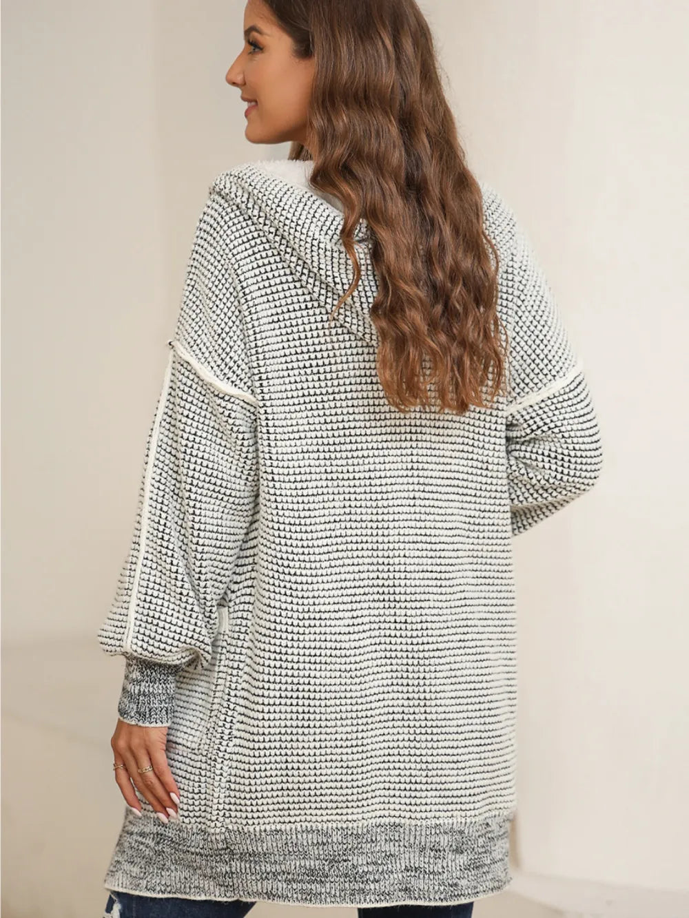 Open-front hooded winter coat with pockets, textured gray-and-white knit, hooded back view.