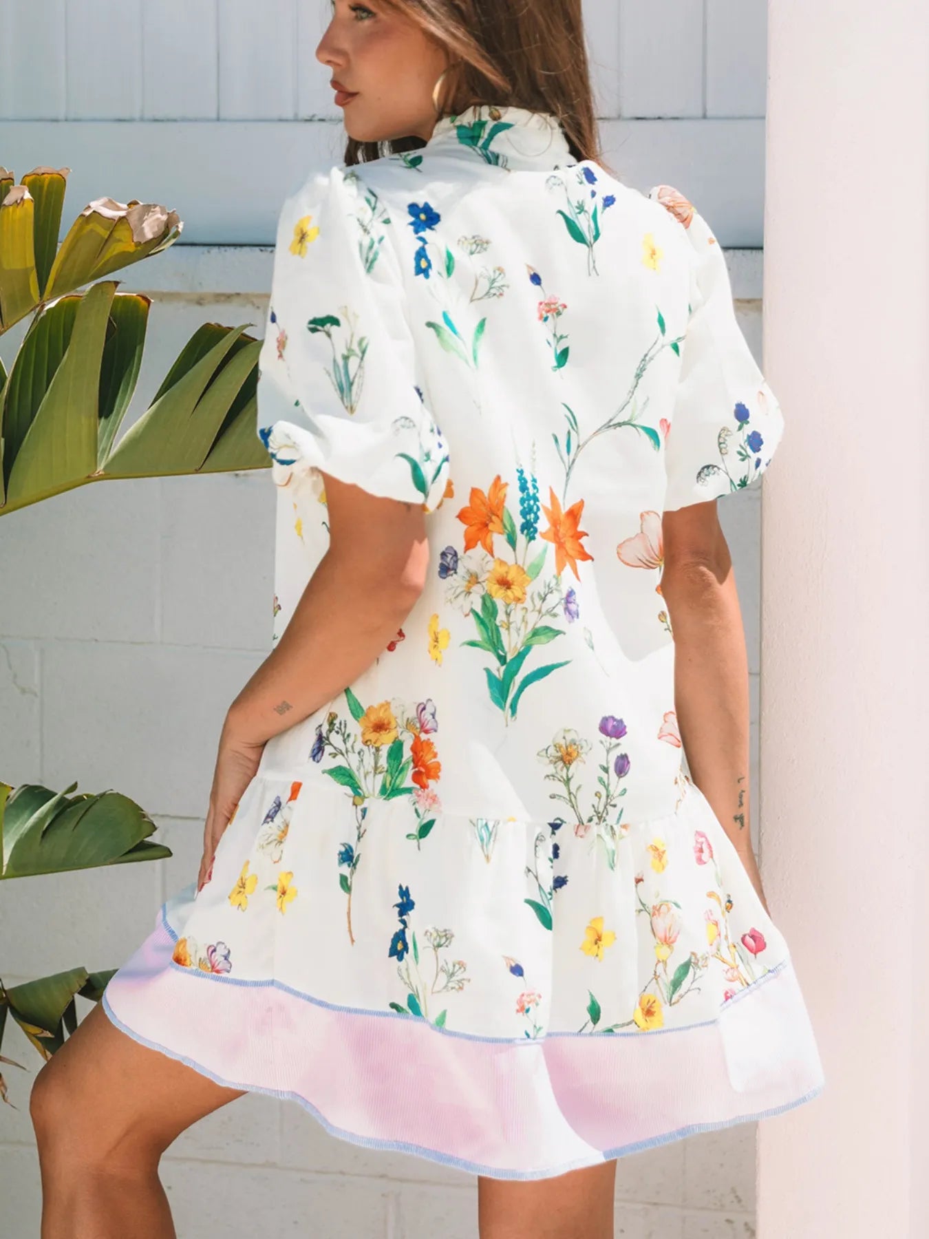 Floral Print Notched Short Sleeve Dress, white base with multicolor blooms and pink hem.
