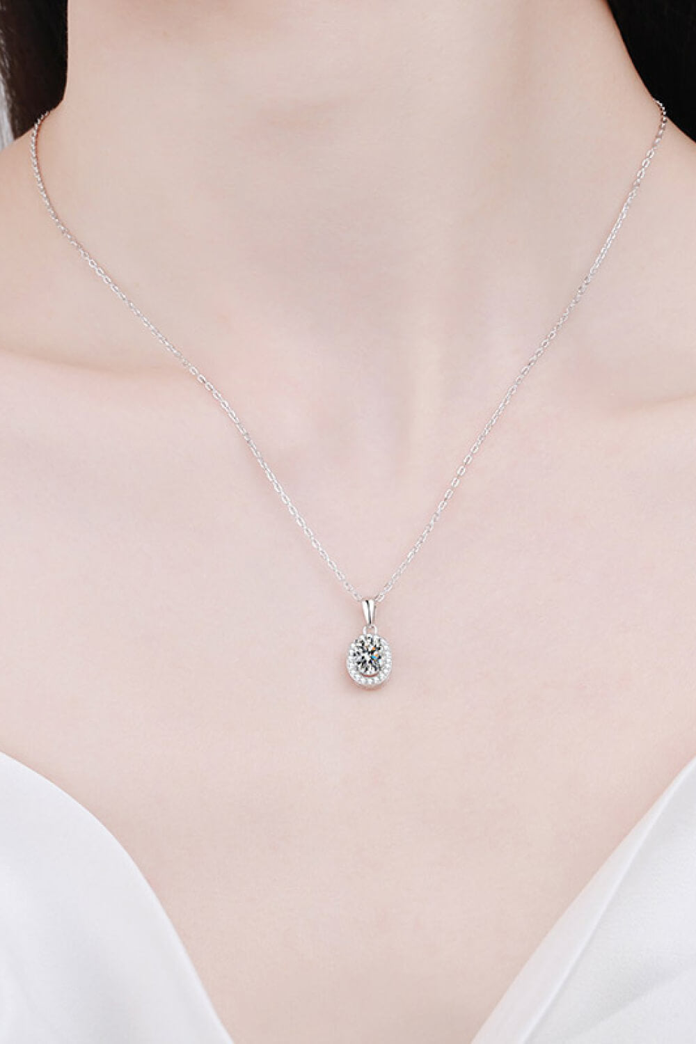 Silver chain necklace with small round moissanite pendant