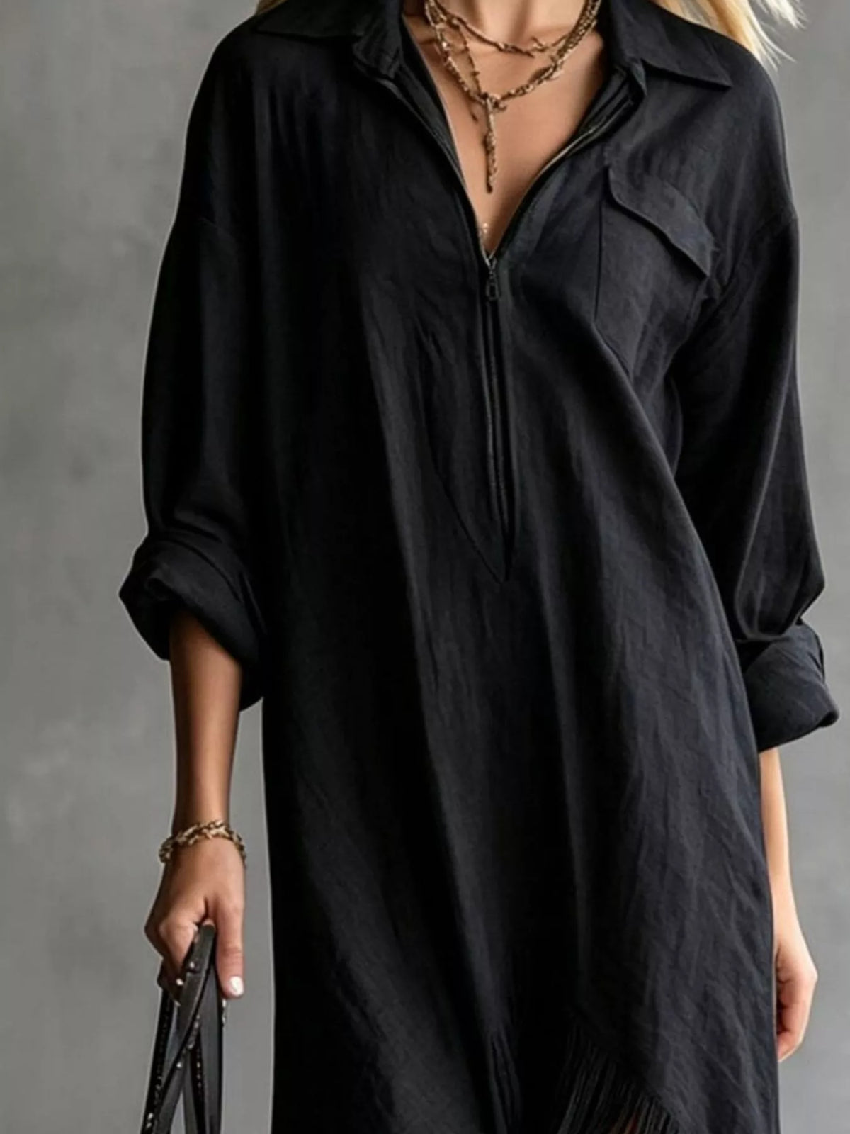 Black midi dress with front zipper, collared neckline, and roomy sleeves