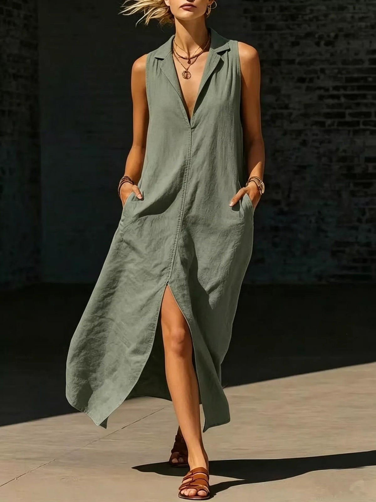 Moss green sleeveless maxi dress with deep V-neck and side pockets, front slit