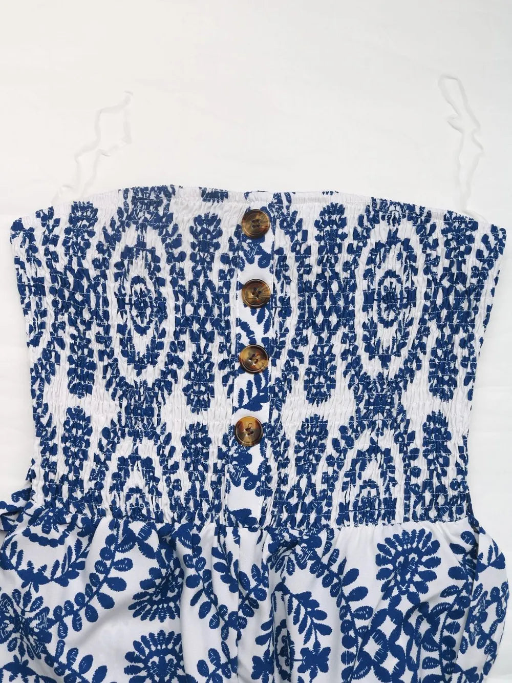 Blue-and-white strapless jumpsuit bodice with button placket and smocked panel