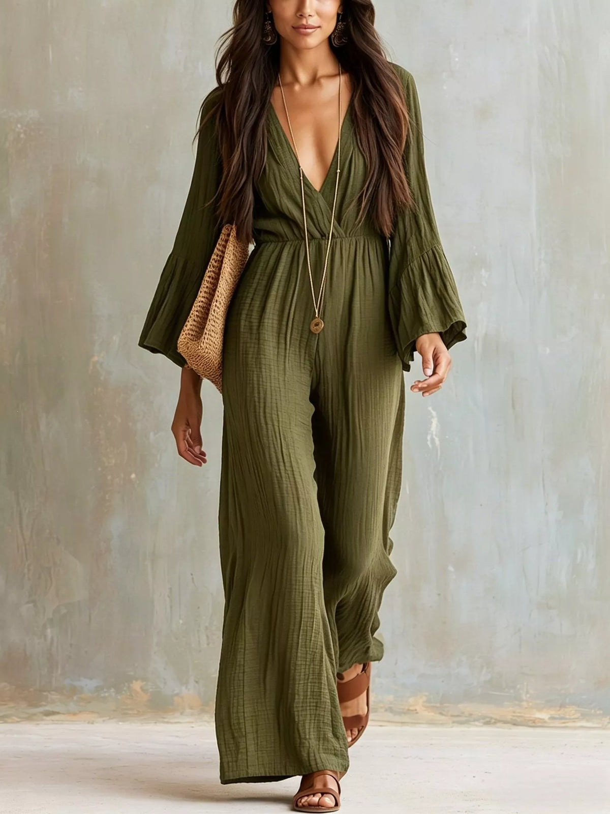 Army green textured flare-sleeve jumpsuit with deep V-neck and wide-leg silhouette