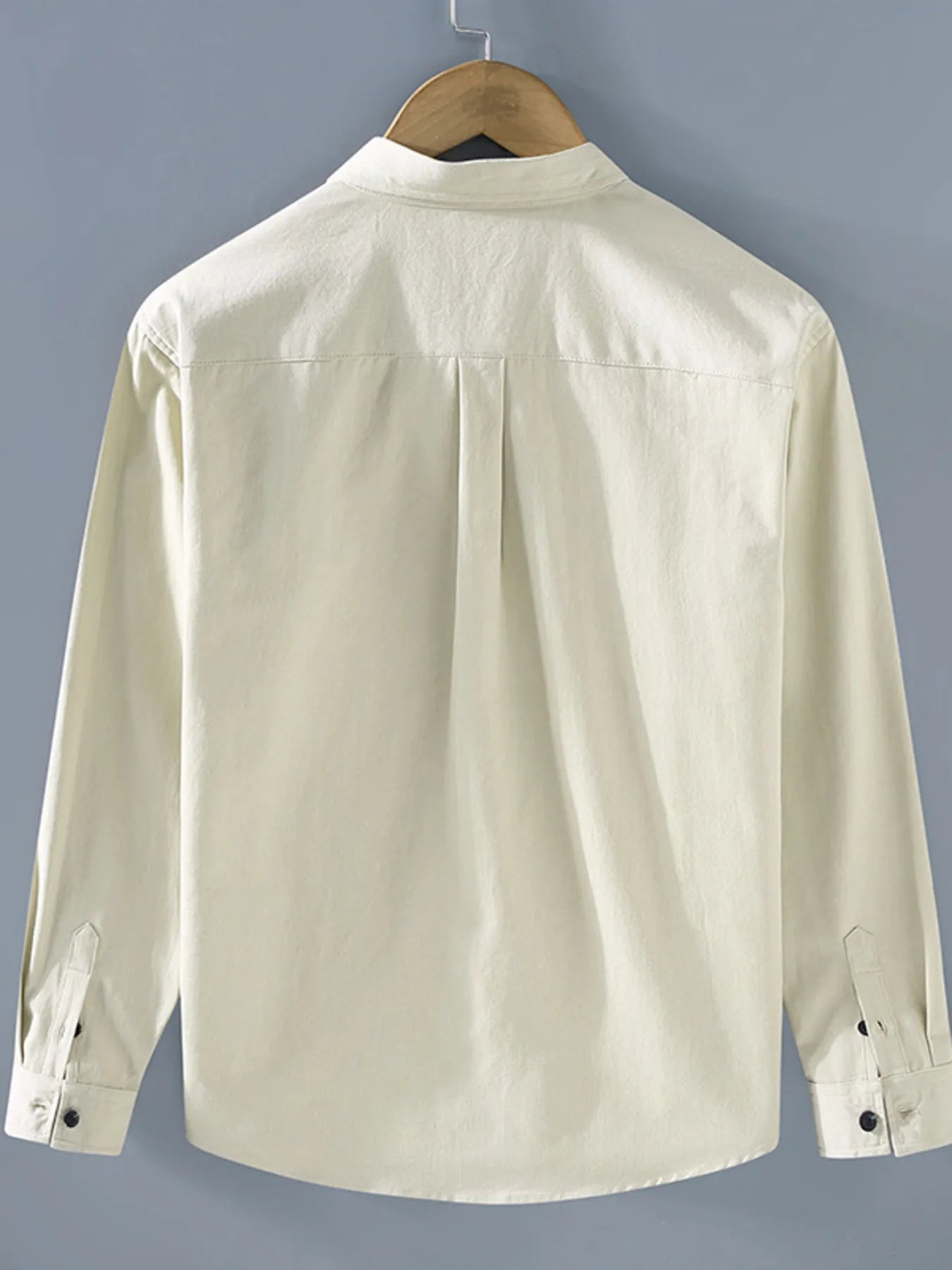 Off-white long sleeve button-up shirt, back view with yoke pleats