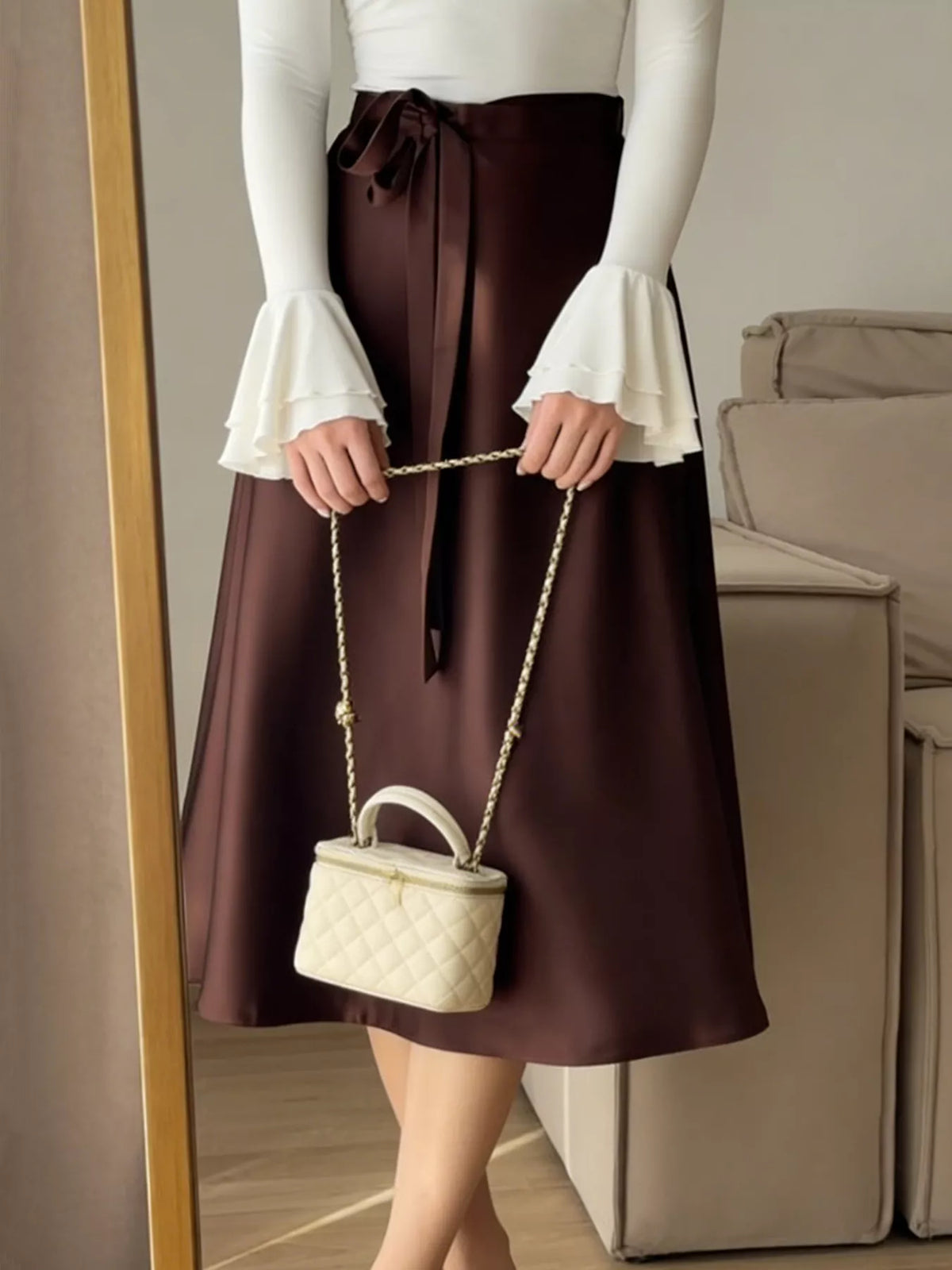 Burgundy satin A-line midi skirt with long tie bow at waist