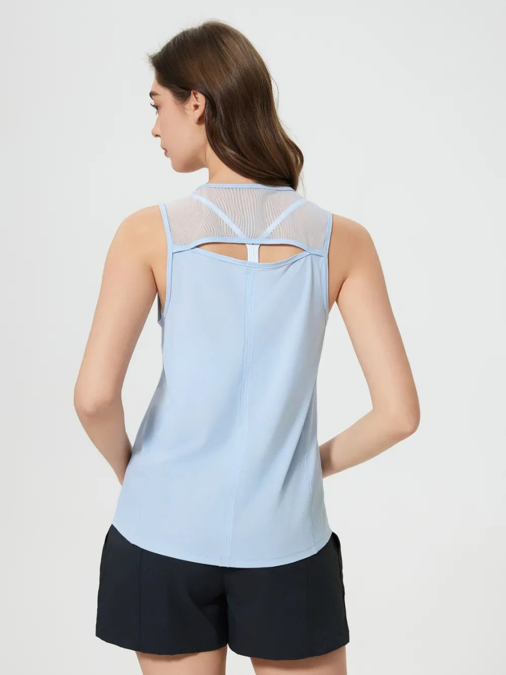 Light blue active tank top with cutout back and crisscross strap detail