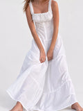 White cotton maxi dress with ruffled square neck, smocked bodice, tiered skirt