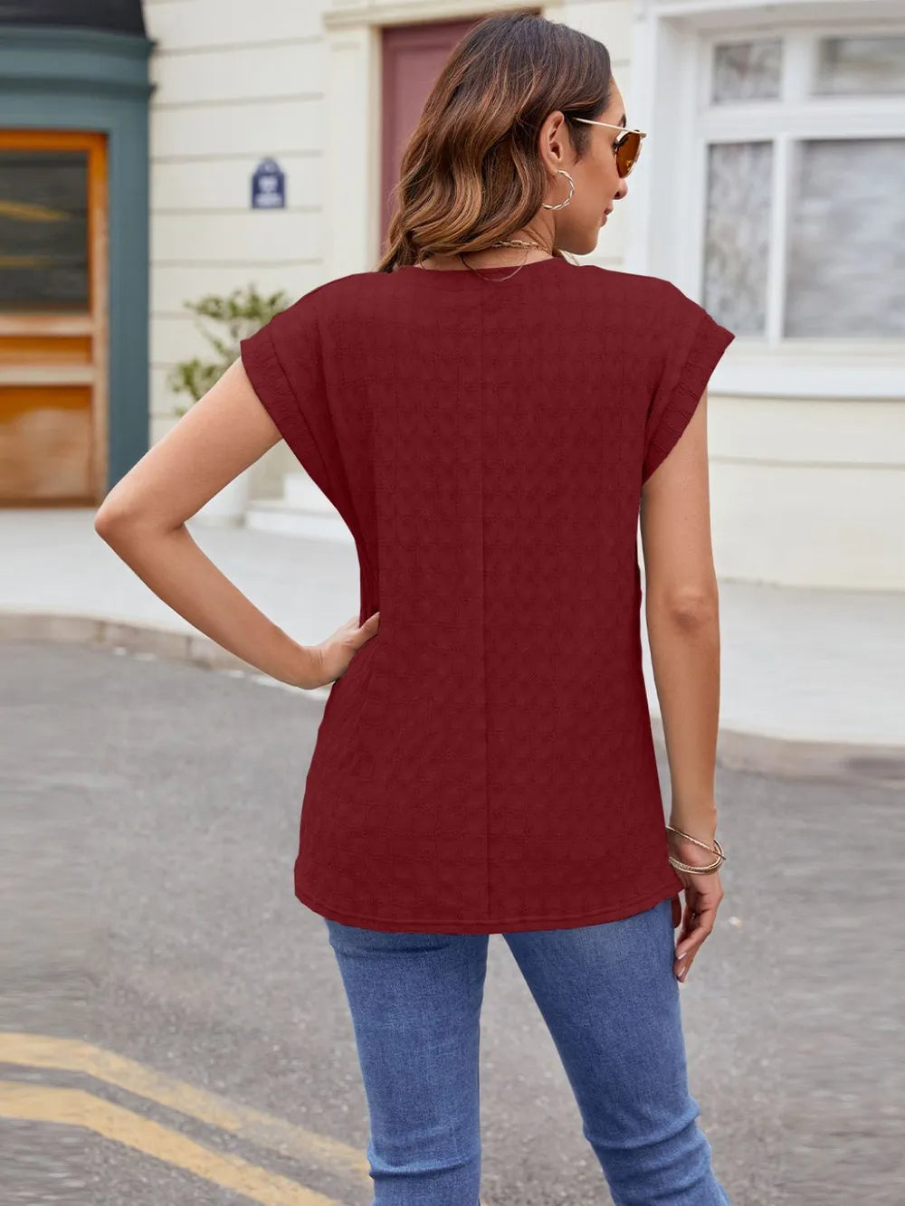 Textured round neck cap-sleeve T-shirt in wine red, back view with cap sleeves.