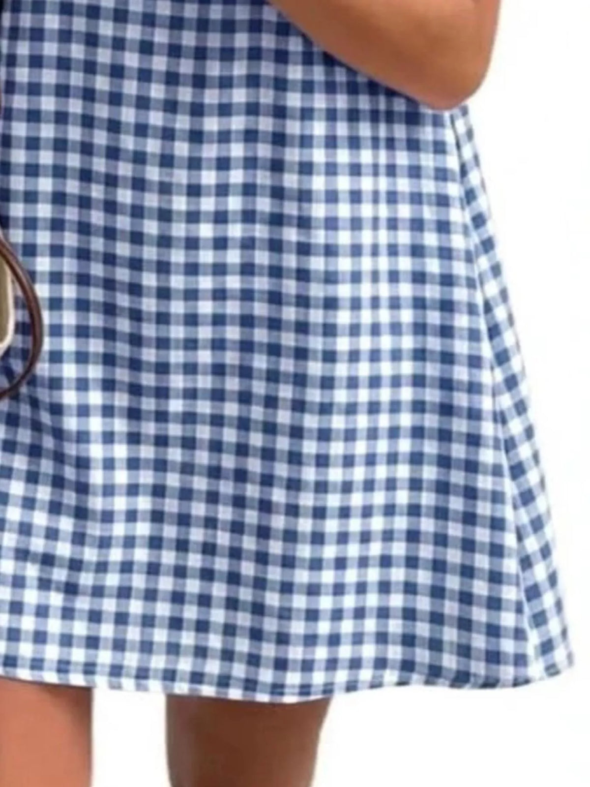 Blue and white gingham sleeveless A-line mini dress, check pattern close-up
